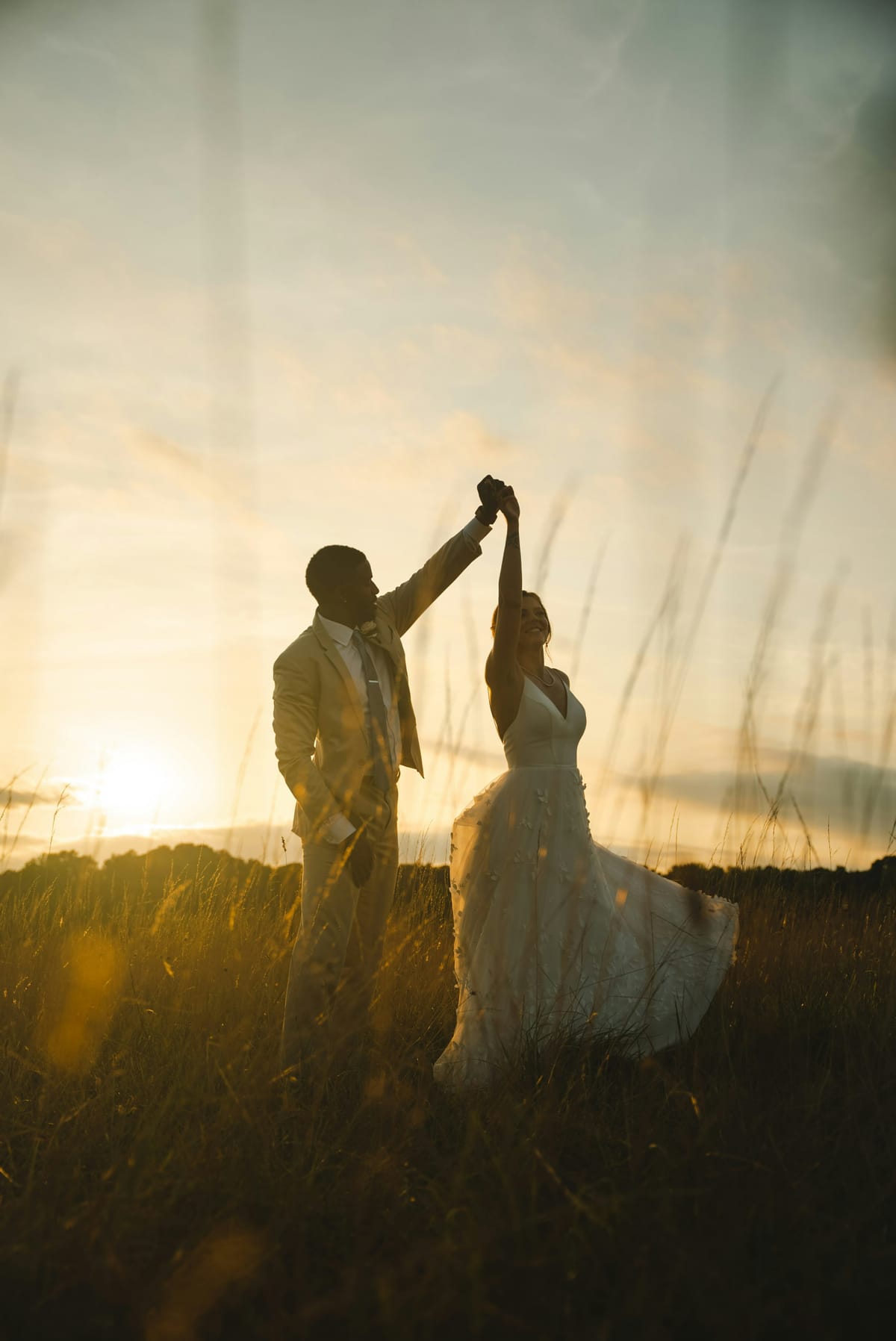 A couple silhouetted at golden hour